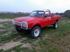 Louer une PEUGEOT 504 Pick Up Dangel de de 1987 (Photo 2)